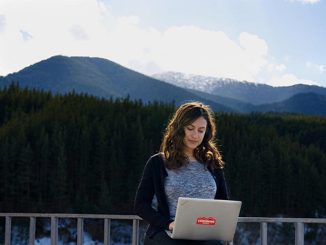Woman working remotely outside